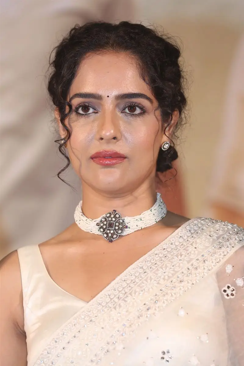 Malvi Malhotra In White Saree at Tiragabadara Saami Movie Press Meet